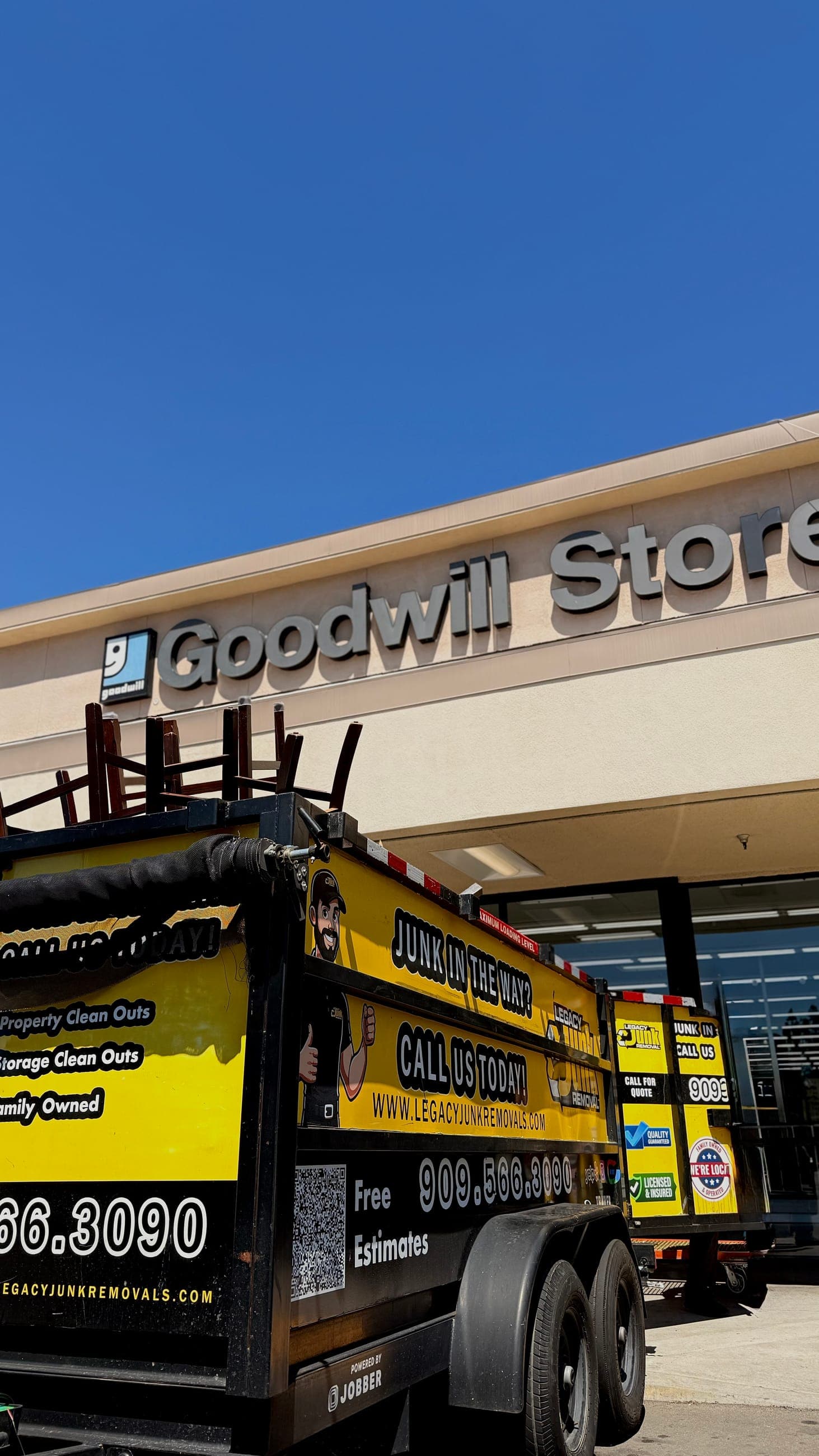 A loaded Legacy trailer parked outside a Goodwill store for a donation drop-off